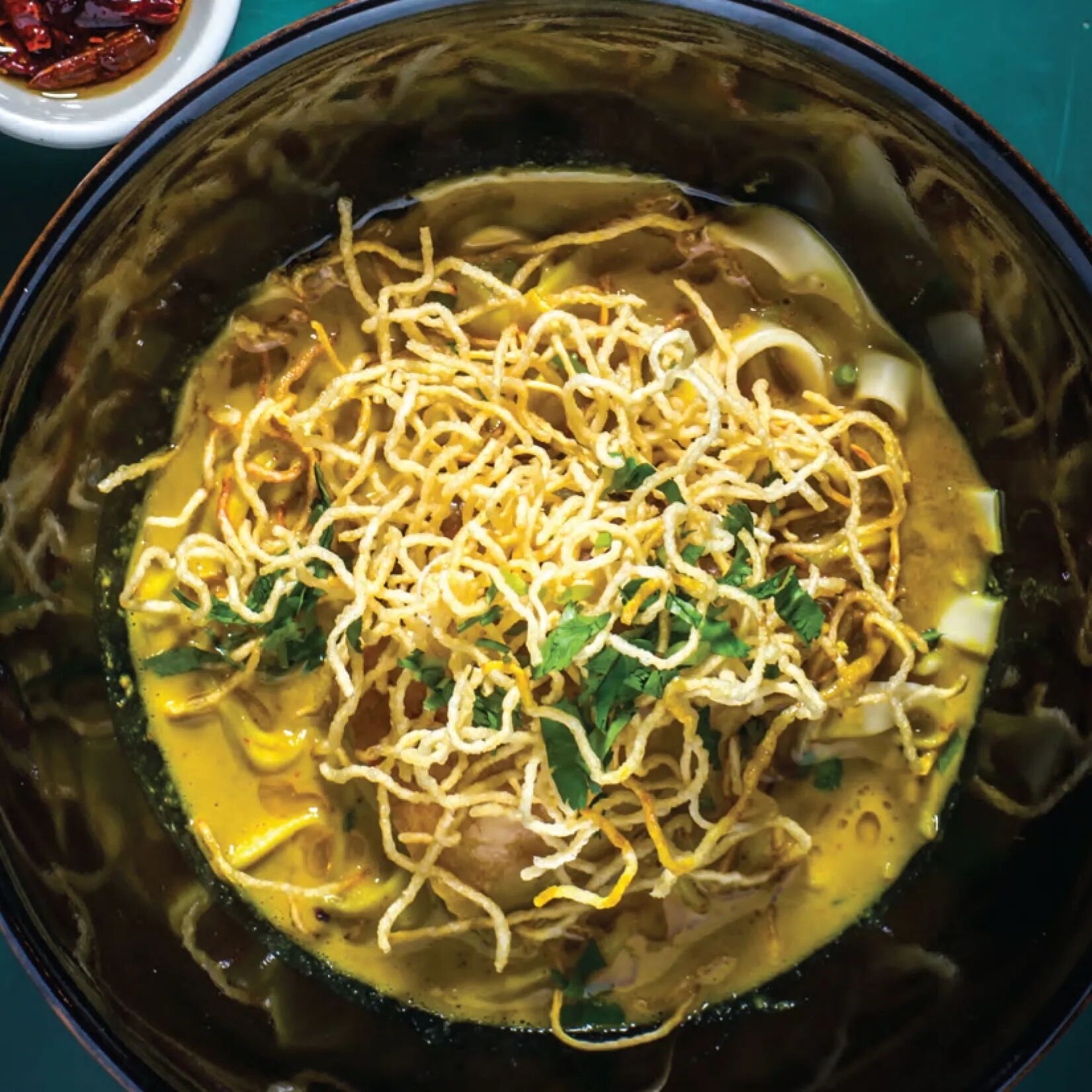 Savor the rich coconut curry of Thailand’s Khao Soi